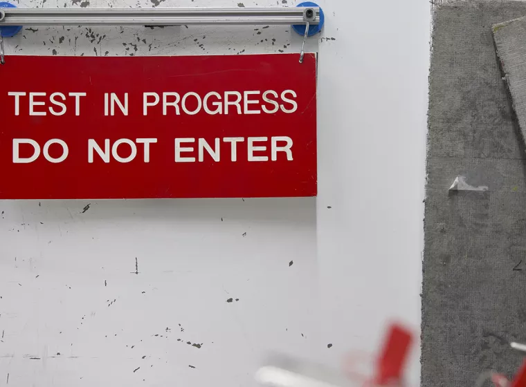 A red warning sign. Exponent helps you improve your risk communication strategy, improve safety and mitigate risks.