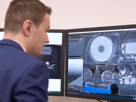 A person reviews the detailed images of batteries on a computer screen. Exponent conducts detailed battery analysis for safety and performance. 