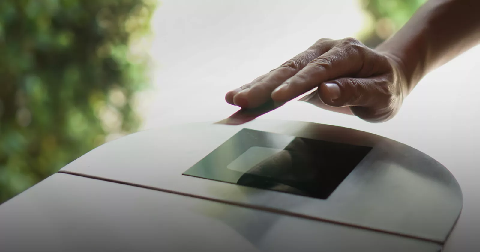 Military personnel scans ID card. Exponent supports government and private sectors in improving safety and advancing technology.