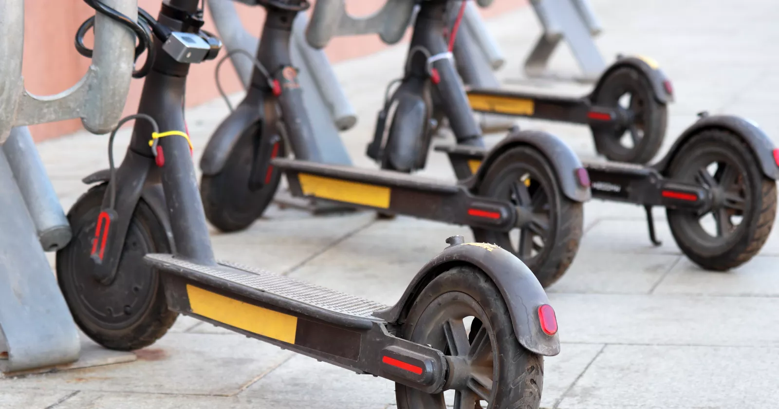 A row of battery powered scooters.  Exponent provides electrical engineering support for consumer products.