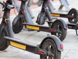 A row of battery powered scooters. Exponent provides electrical engineering support for consumer products.