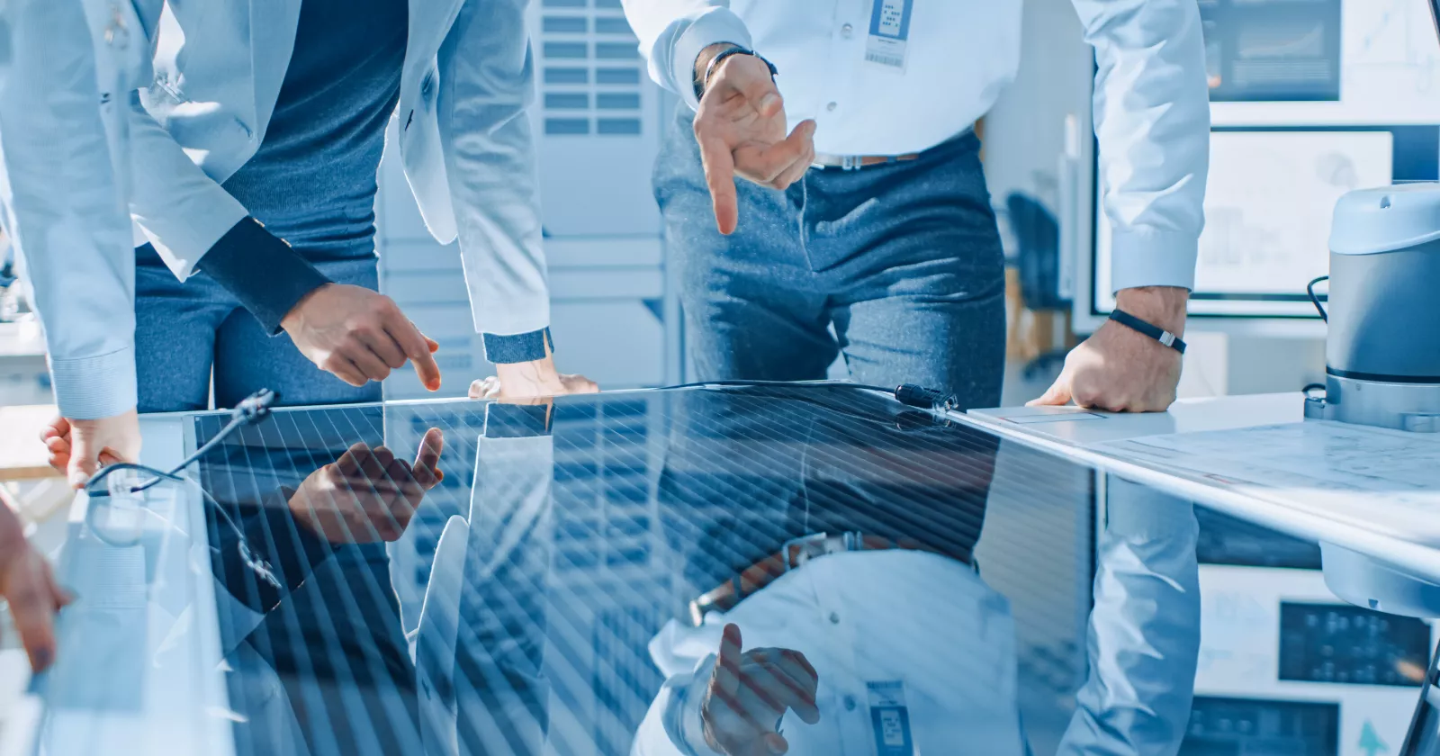 Consultants inspect an energy panel. Exponent engineering expertise for energy systems.
