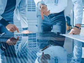 Consultants inspect an energy panel. Exponent engineering expertise for energy systems.