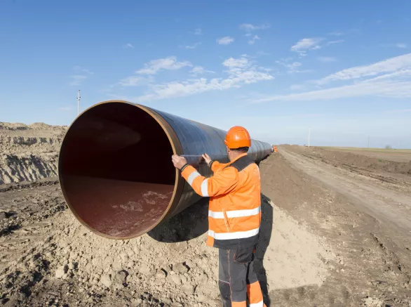 Workers at gas pipeline construction site.