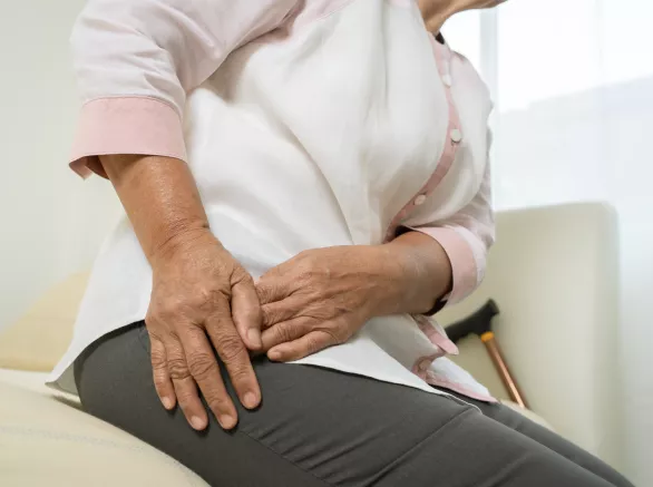 Hip pain of senior woman at home, healthcare problem of senior concept