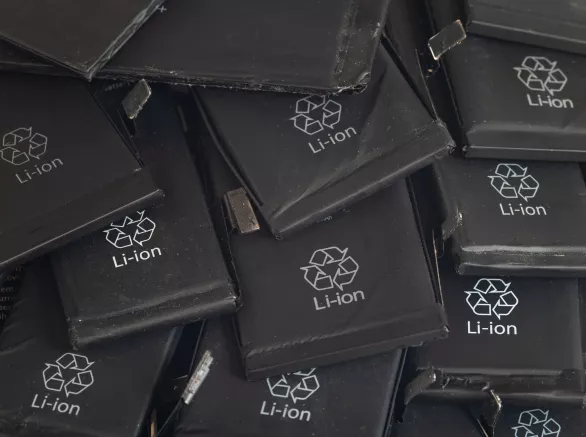 Close up of old used lithium polymer batteries of mobile phones preparation for recycling.