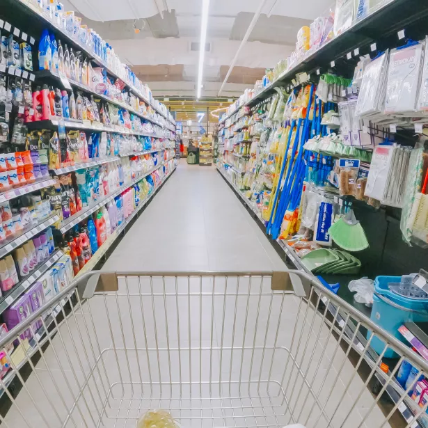 shopping cart in supermarket aisle