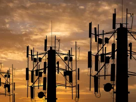 Three tall communication towers. Exponent engineers provide technical expertise for all wireless communications.