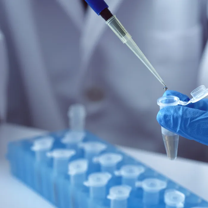 scientist using auto-pipette with Eppendorf consumables tube in the lab,Doing experiment for product,The researchers analyzed to find the results of the experiment.