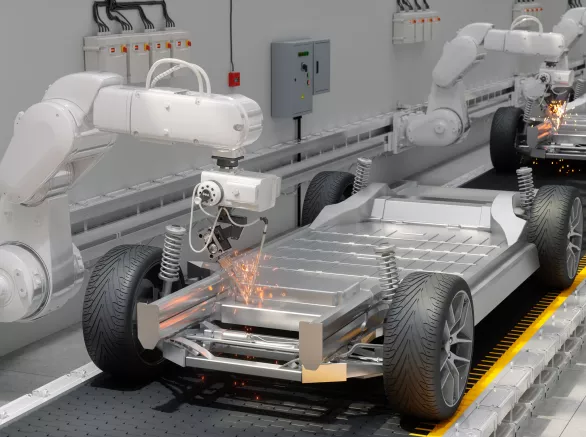 Close-up View Of Robot Arms Assembling Cars In Car Factory
