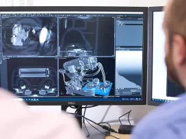 London - 2 working on computer, technical things on screen