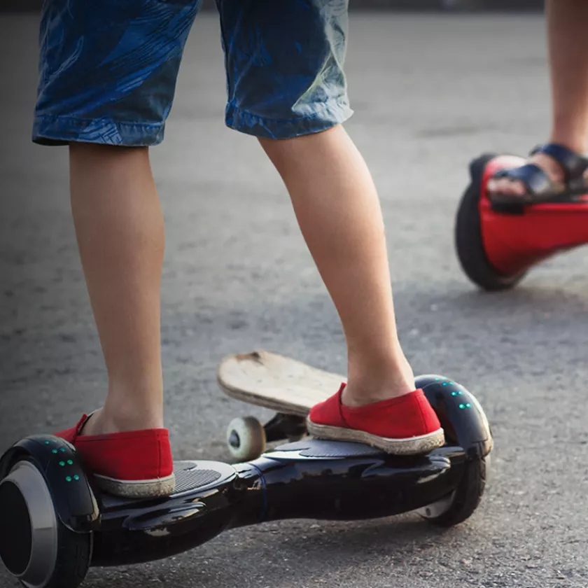 Child on electric scooter. Exponent researchers test the safety and performance and help with issues of product recall. 