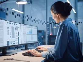 Data engineer reviews data on two monitors. Exponent provides expert support for all areas of integrated sensor system design and analysis.