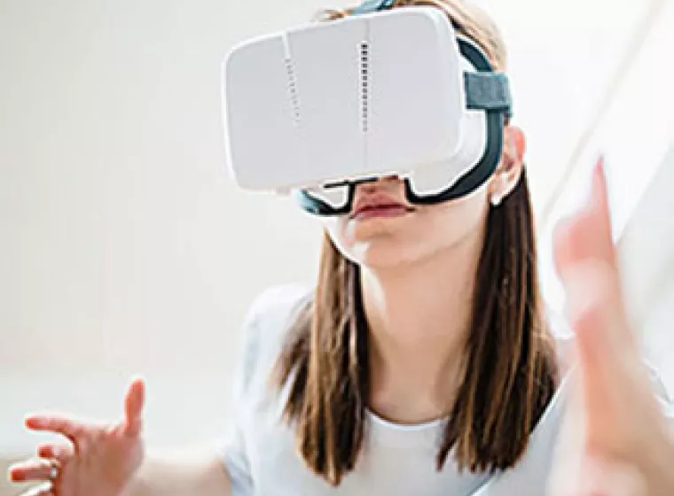 Person wearing a virtual reality headset. Exponent helps innovators explore the possibilities of virtual reality products.