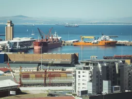 Ships in a harbor dock. Exponent technical consultants conduct environmental assessments and analyze contaminated sediment. 